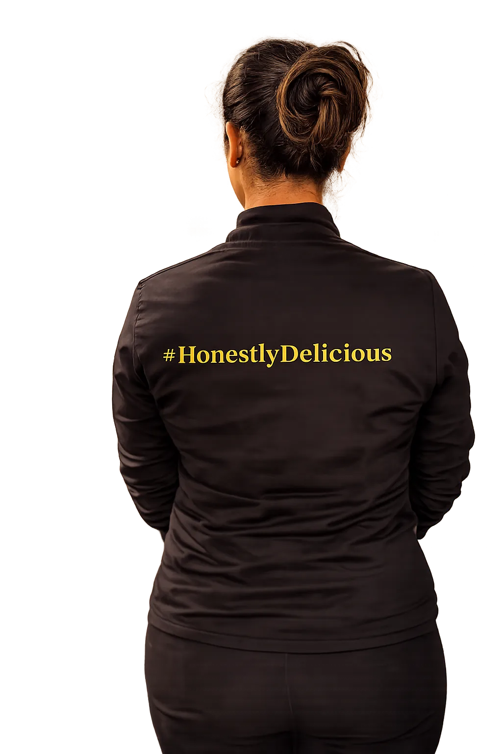 Heirloom team member seen from behind in a black jacket printed with #HonestlyDelicious